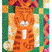 Multi colored quilt block with an orange jungle cat and geometric designs.