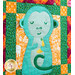 Multi colored quilt block with a blue monkey and geometric designs.