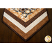 Table runner with central diamond design and angled strips the ends made of coffee themed fabrics in neutral colors.
