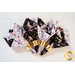 Reversible cloth napkins one side features black fabric with purple butterflies, the other side features white fabric with purple florals.
