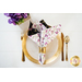 Reversible cloth napkin one side features black fabric with purple butterflies, the other side features white fabric with purple florals.