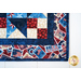 Red, white, and blue table runner made of patriotic fabric prints and geometric piecing.