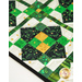 Cream table runner featuring green, black, and yellow geometric designs.