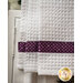 White waffle textured towel with purple banding with tonal stars.