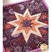 Squared hot pad with central folded star design made of purple floral fabrics.