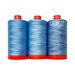 Three blue spools from the Aurifil Passionflower thread set