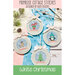 The front of the White Christmas Cross Stitch pattern by Primrose Cottage Stitches showing the finished projects.