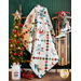 White quilt with lattice made of small squares and holiday motifs in between draped over furniture.