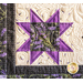 Wall hanging with geometric shapes and florals with vines made of purple and cream fabrics.