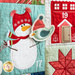 Close up of Patchwork quilt featuring Christmas themed motifs including a snowman.