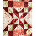 Red, Pink, and Cream quilt with geometric designs made of floral fabrics.