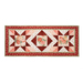 Red, pink, and cream table runner with geometric designs and floral prints.