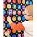 Small boy looking at the I Spy Quilt through a magnifying glass