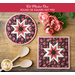 Two hot pads with central folded star design made of floral red, and white fabrics.