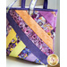 Tote bag made from diagonal strips of multicolor floral fabrics.