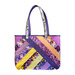 Tote bag made from diagonal strips of multicolor floral fabrics.