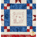 Quilt block with red, white, and blue fabrics and embroidery of a thread spool, and a summer banner.