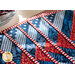 Placemats made of strips of patriotic printed red, white, and blue strips of fabric in a diamond design.