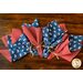 Reversible cloth napkins, one side printed with sheep wearing a US flag on blue, the other with red and white gingham.