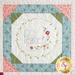 Close up image of one of the blocks of the wall hanging quilt that reads: peace