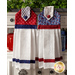 Red, white, and blue hanging towel made of prints featuring branches and stars next to matching towel with dots.