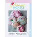 the front of the pattern booklet featuring five finished pincushions on a pale blue blanket