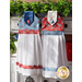 Hanging towel featuring a blue floral print and red and white plaid accents next to matching towel in red.