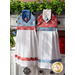 Hanging towel featuring a red paisley print and blue and white plaid accents next to matching towel in blue.