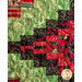 A vibrant quilt featuring a patchwork of green, red, and black fabrics with intricate patterns.