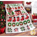 Quilt featuring rows of Christmas themed motifs on white background draped over furniture.
