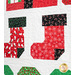Quilt featuring rows of Christmas themed motifs on white background.