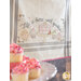 Styled image of cupcakes and a Sprinkles Embroidery Towel.