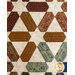 A quilt featuring geometric patterns in warm tones of brown, green, and cream.