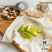 sliced green apples resting on a fabric beeswax wrap