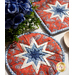 Hot pads with central folded star design made of red and blue fabrics featuring paisleys.