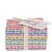 Pastel fabric folded in squares in a stack and tied with ribbon and a label