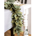 The felt Sage Leaf Centerpiece draped over the edge of a table