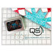 The Quilters Select storage tin full of pins on a quilting ruler