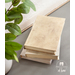 Three books with fabric book covers on a table