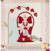 Quilt block featuring an angel in a basket with florals and a bird.