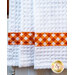 White waffle textured towel with orange gingham banding.
