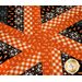 Halloween themed table topper with diamonds made of strips of black and orange fabric.