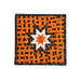 Orange Halloween themed hot pad featuring black cats along with black and white accent fabrics.