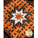 Orange Halloween themed hot pad featuring black cats along with black and white accent fabrics.