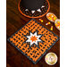 Orange Halloween themed hot pad featuring black cats along with black and white accent fabrics.