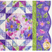 close up image of quilt edge, with intricate quilting and a green border