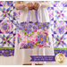 Close up of a finished tote bag with purple watercolor styled flower fabrics