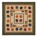 An autumn themed quilt with tossed maple leaf blocks on a white background