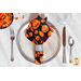 A Too Cute to Spook jack-o-lantern Cloth Napkin on a plate.