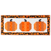 Table runner featuring 3 pumpkins made of strips of orange and black halloween themed fabrics.